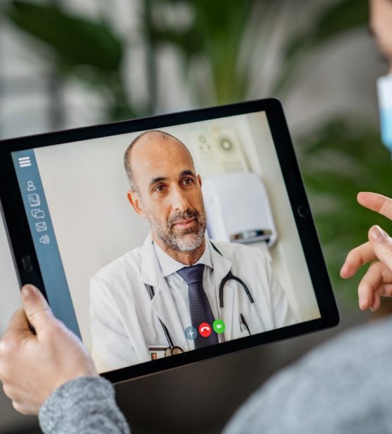 doctor on tablet device
